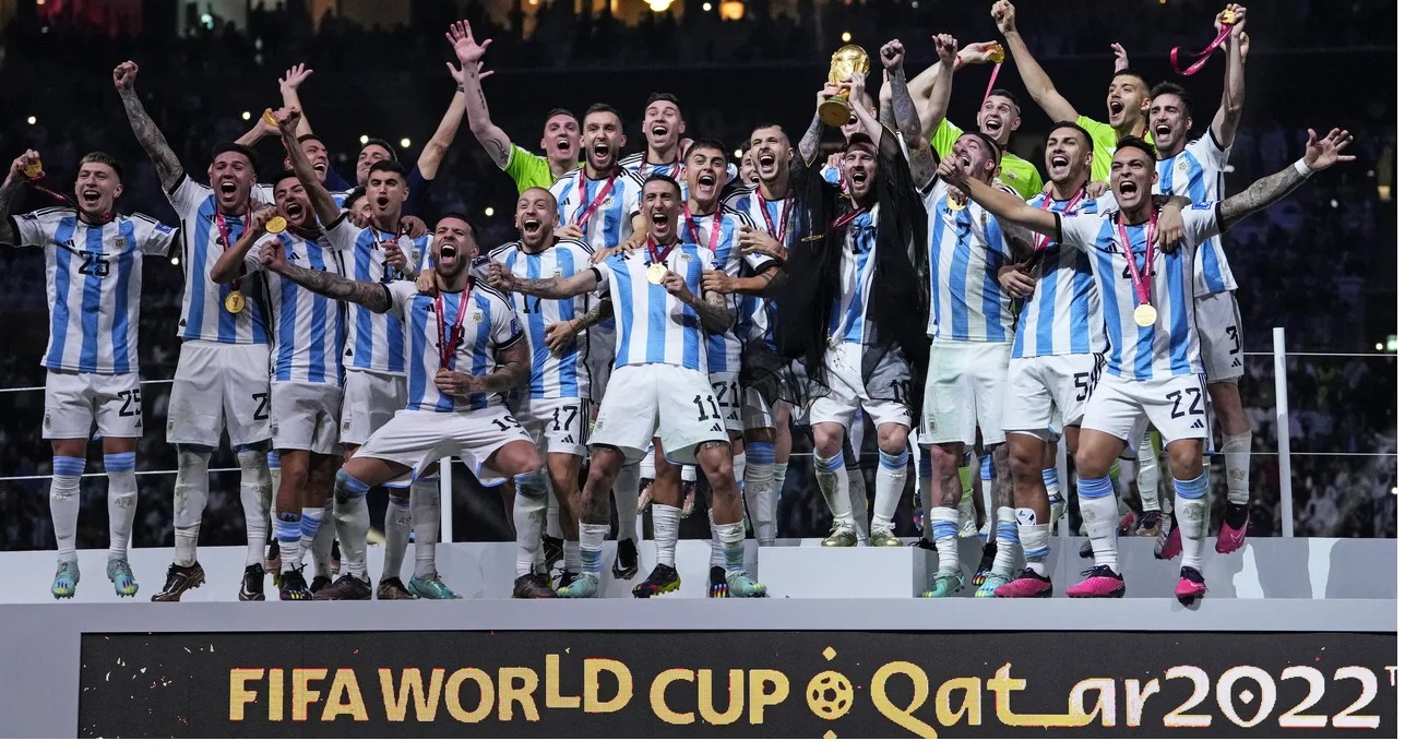 Argentina celebrating World Cup 2022 victory with Lionel Messi holding the trophy